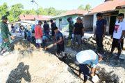 Semangat Kebersamaan Satgas TMMD ke-129 Kodim 1505/Tidore dan Warga Terus Menggelora di Lokasi Pembangunan Drainase